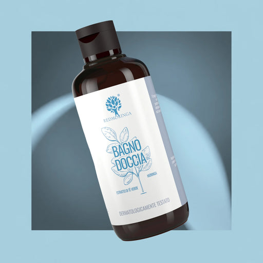 RedMoringa Moringa body wash with green tea extract, amber bottle with white label on a light blue background