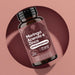 Frasco Moringa Acerola y Zinc RedMoringa, complemento defensas inmunitarias, 60 cápsulas de 535 mg sobre fondo rosa